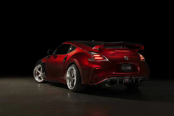 A red Nissan 370Z with Morimoto XB LED NISMO DRLs
