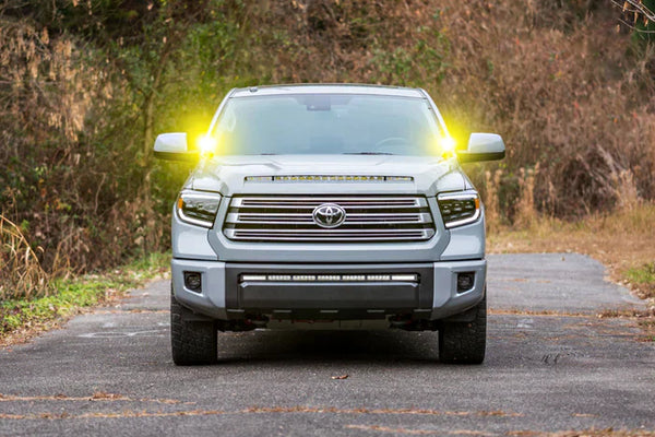 A photo of a toyota offroad vehicle equipped with a Morimoto LED lighting system, making it ideal for offroad fall trail adventures.