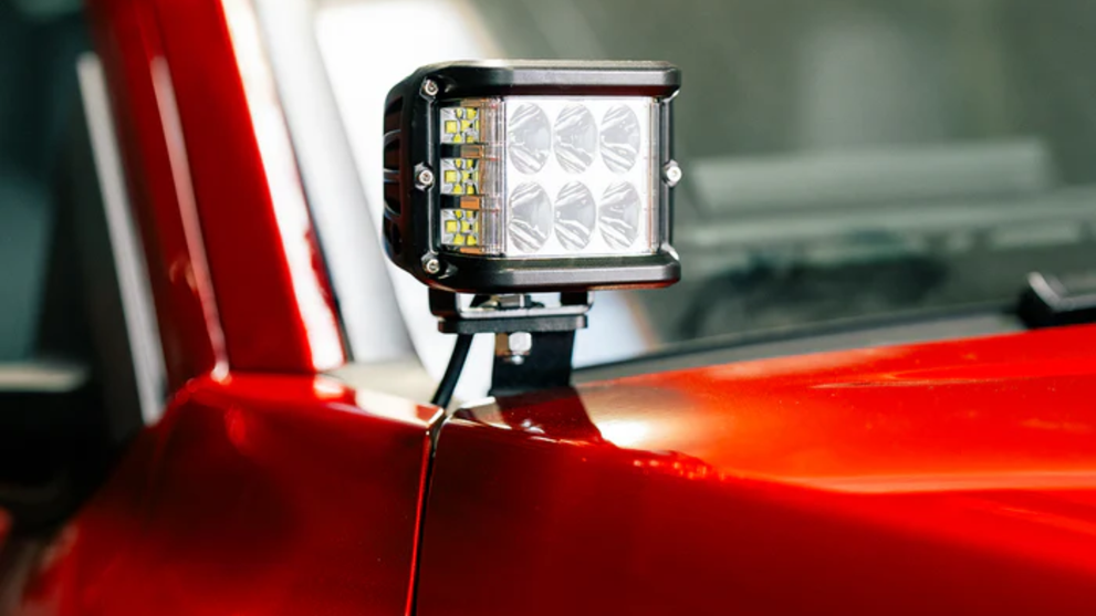 Off-road ditch light on hood bracket