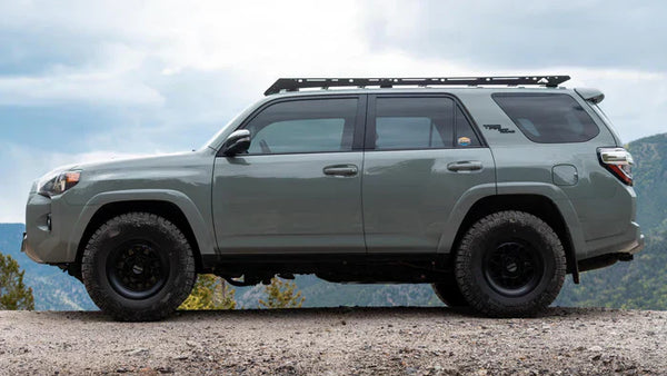 A photo of a toyota 4runner with a sherpa roof rack mounted on it.