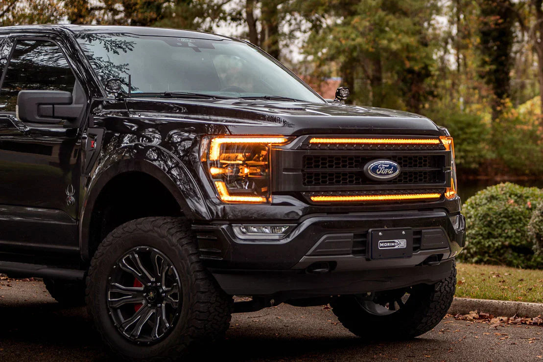 Morimoto XB LED headlights on a Ford F-150 showcasing 200% more light output and a sharp cutoff line. Best prices on F-150 lighting at OffRoadUSA.