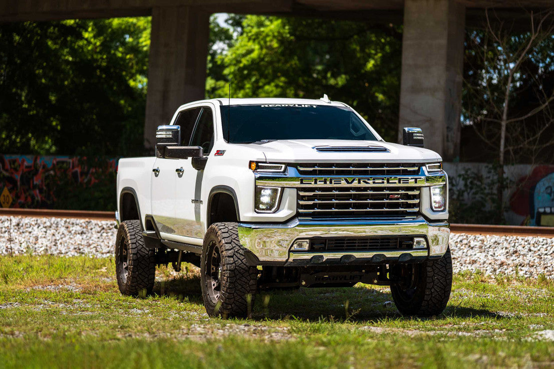 AlphaRex Nova-Series LED projector headlights for 2014-2018 Chevy Silverado 1500 featuring midnight black housings and sequential turn signals. Shop OffRoadUSA.