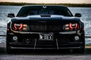 Front end of a Chevrolet Camaro with red LED headlight halo rings installed.