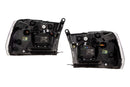 Two car headlight assemblies on a white background