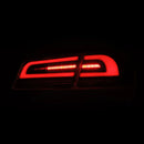 AlphaRex 12-21 Tesla Model S LUXX-Series LED Tail Lights Alpha-Black (With Black Trunk Center Piece Replacement)