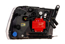 Close-up of a label printer cartridge with a red label and visible brand logo.