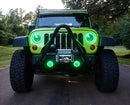 Front end of a Jeep Wrangler JK with green LED headlight and fog light halos installed.