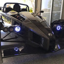 Ariel Atom with white headlight halos.