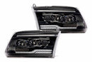 Pair of black car headlights on a white background