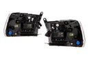 Two car headlight assemblies on a white background