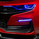 Close-up on a red Chevrolet Camaro with blue fog light DRLs.