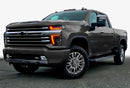Three quarters view of a Chevy Silverado with amber headlight DRLs.