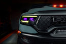 Close-up of Ram 1500 headlights with yellow DRLs and purple demon eye projectors.