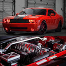Red dodge challenger with red headlight and fog light halos