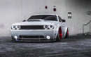 White dodge challenger with white headlight and fog light halos