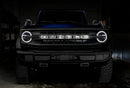 Front view of a Ford Bronco with white halo headlights.