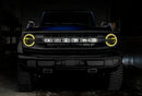 Front view of a Ford Bronco with yellow halo headlights.