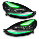 Tesla Model 3 headlights with green DRLs.