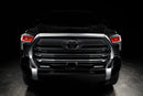  Straight front view of a black Toyota Tundra with red demon eye projectors.