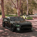 Three quarters view of a Ford Mustang with green headlight halos and DRLs installed.