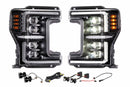 A photo of two Morimoto XB EVO Hybrid LED Headlights and components set against a white background.