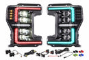 A photo of Morimoto XRGB Evo LED Headlights against a white background with components laid out in front of them.