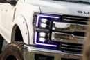 A photo of a 2019 Ford Super Duty truck with a Morimoto XRGB Evo LED Headlight lit up purple.