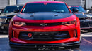 Front view of a Chevrolet Camaro with red headlight and fog light DRLs.