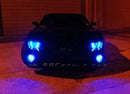 Front end of a Chevrolet Camaro with blue LED headlight and fog light halo rings installed.