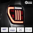 Car tail light with certification logos and warranty information on a dark background