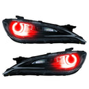Chrysler 200 headlights with red LED halo rings.