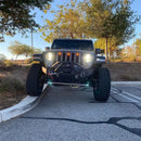 Front end of a Jeep Wrangler JL with amber Pre-Runner Style LED Grill Light Kit installed.