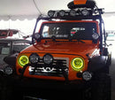 Front end of a Jeep Wrangler JK with yellow LED headlight halos installed.