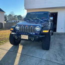 Front end of a Jeep Wrangler with amber LED Grill Light Kit installed.