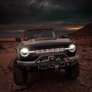 Front view of a Ford Bronco with Universal Illuminated LED Letter Badges installed.