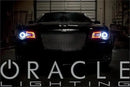 Front view of a Chrysler 300C with white LED halos and red DRLs.