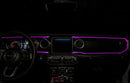 View of a Jeep dashboard from the backseat, with pink fiber optic lighting installed.