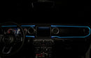 The dashboard of a Jeep with ColorSHIFT Fiber Optic LED Interior Kit installed, glowing cyan.