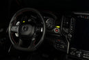 Drivers side seat of a RAM TRX with yellow LED ambient lighting.