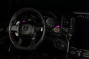 Drivers side seat of a RAM TRX with pink LED ambient lighting.