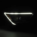 A white signal light on a AlphaRex 24+ Toyota Tacoma / 25-up 4Runner OG-Style LUXX-Series LED Projector Headlights Black
