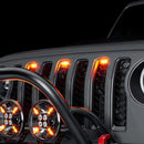 Close-up of Universal Pre-Runner Style LED Grill Light Kit installed on a Jeep Wrangler with amber LEDs.