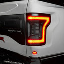 Close up of Flush Style LED Tail Lights installed on white Ford Raptor with brake lights on