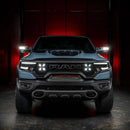 Straight front view of a RAM TRX with LED Off-Road Side Mirror Ditch Lights installed and turned on