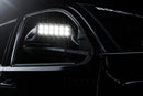 Close up of glowing LED Off-Road Side Mirror Ditch Lights installed on Toyota Tacoma