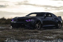 Black camaro with purple DRLs and projector halos