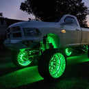 White truck with green LED wheel rings.