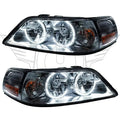 Lincoln Town Car headlights with white LED halo rings.