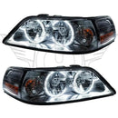 Lincoln Town Car headlights with white LED halo rings.