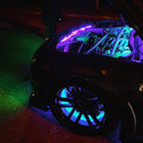 A top down view of the front end of a car, with engine bay lighting and wheel rings turned on.